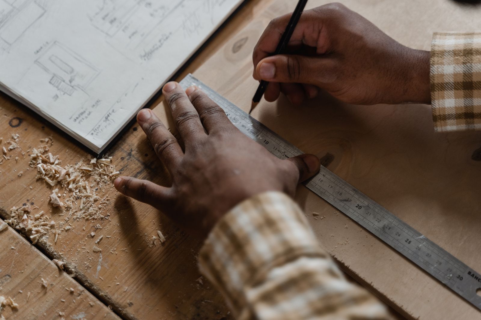Carpentry inspiration: careful measuring and marking of natural timber.